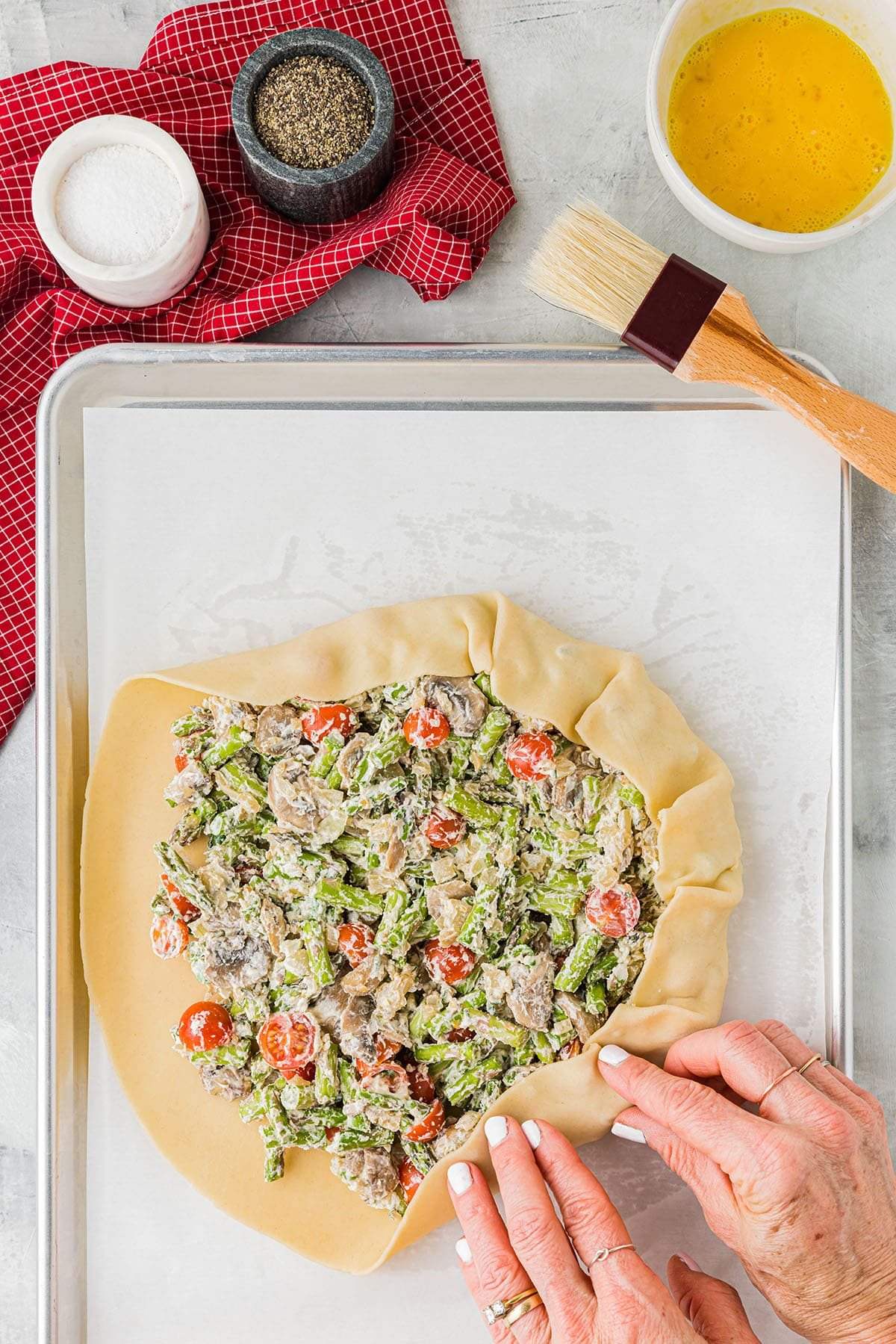 folding pie crust up around galette filling