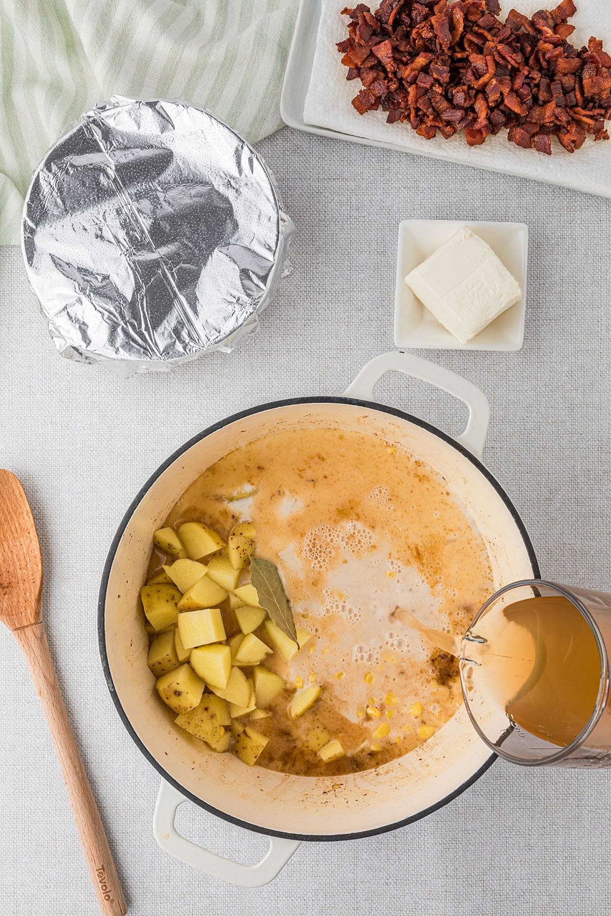making corn chowder in a white dutch oven step 3