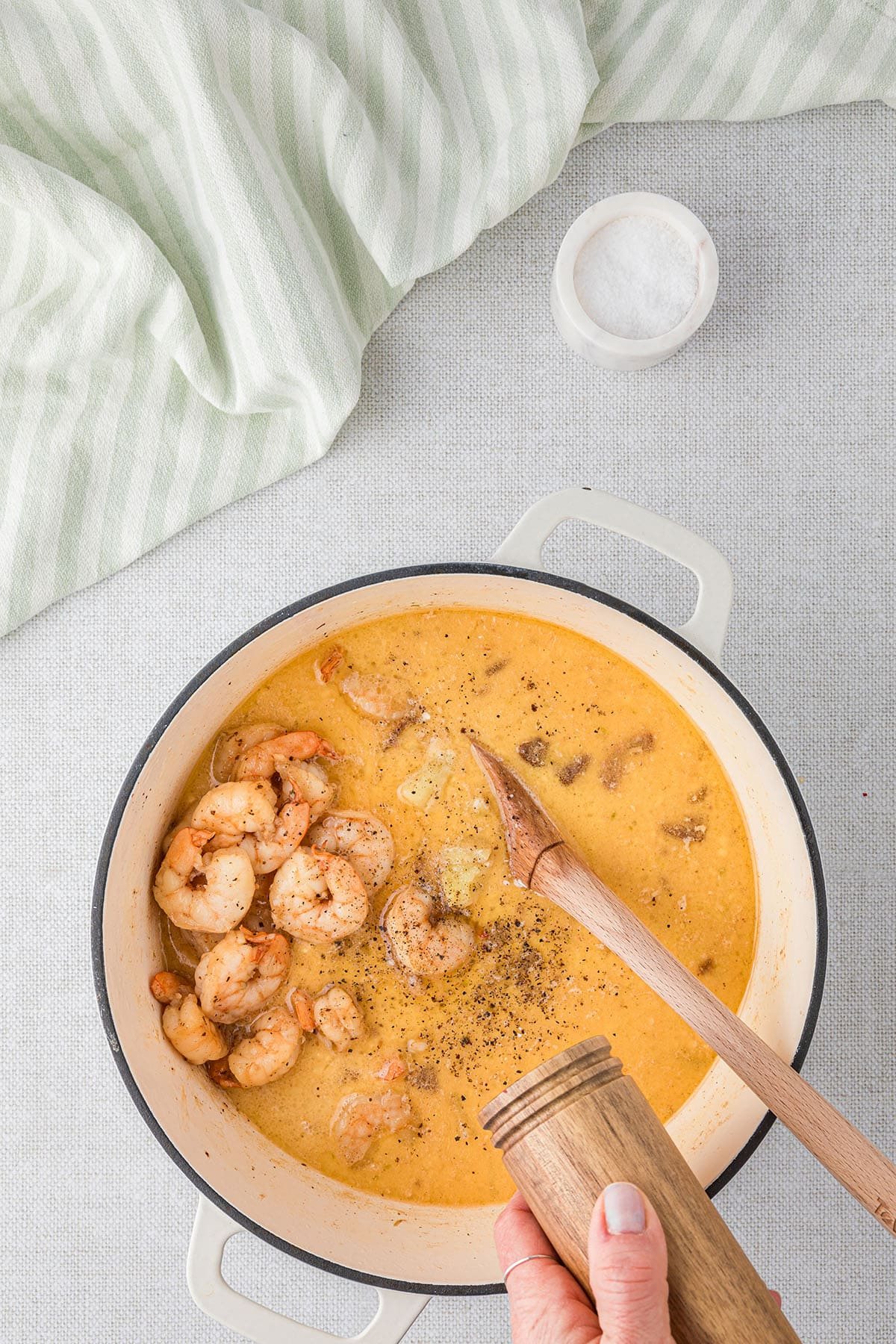 making shrimp corn chowder in a white dutch oven step 4