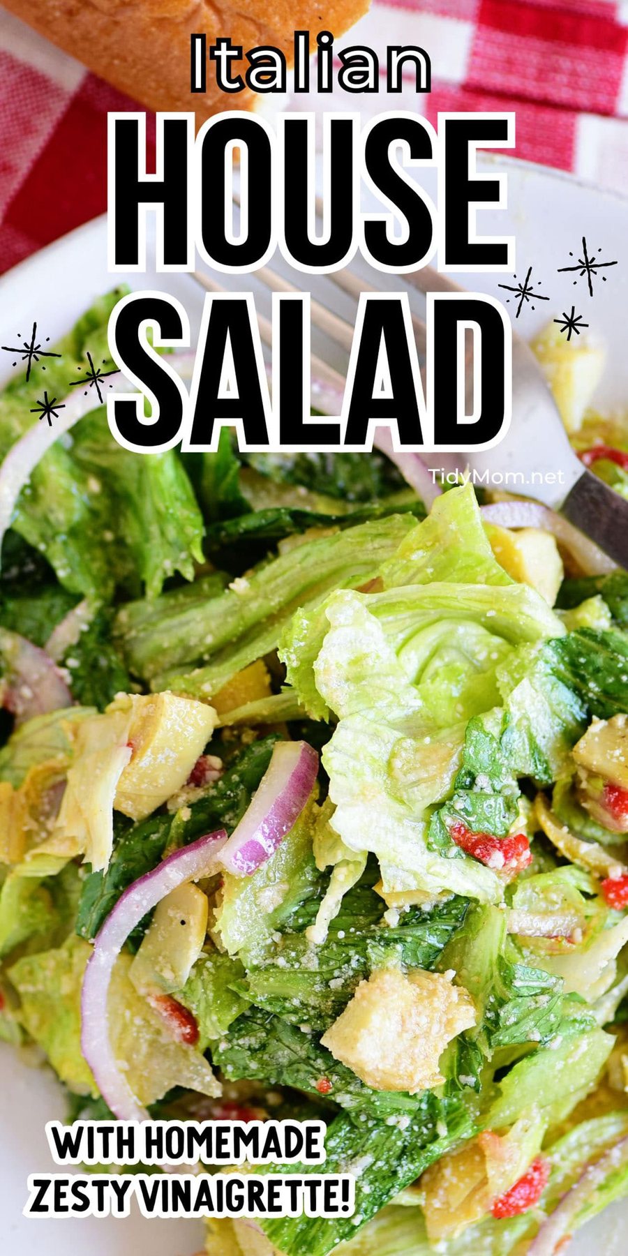house salad on a small plate with a fork