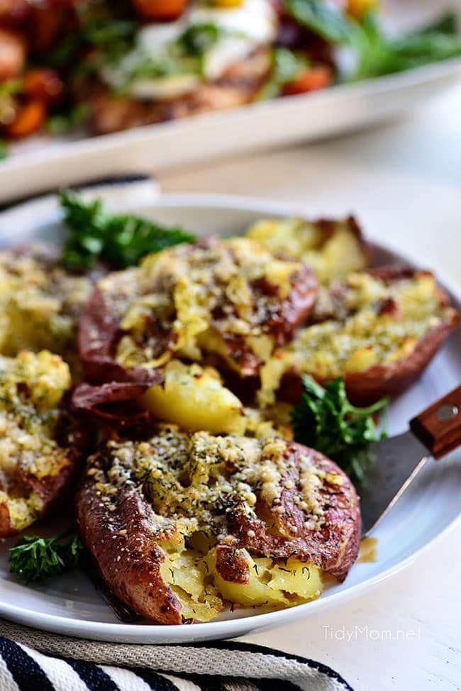smashed potatoes on a plate with a spatula