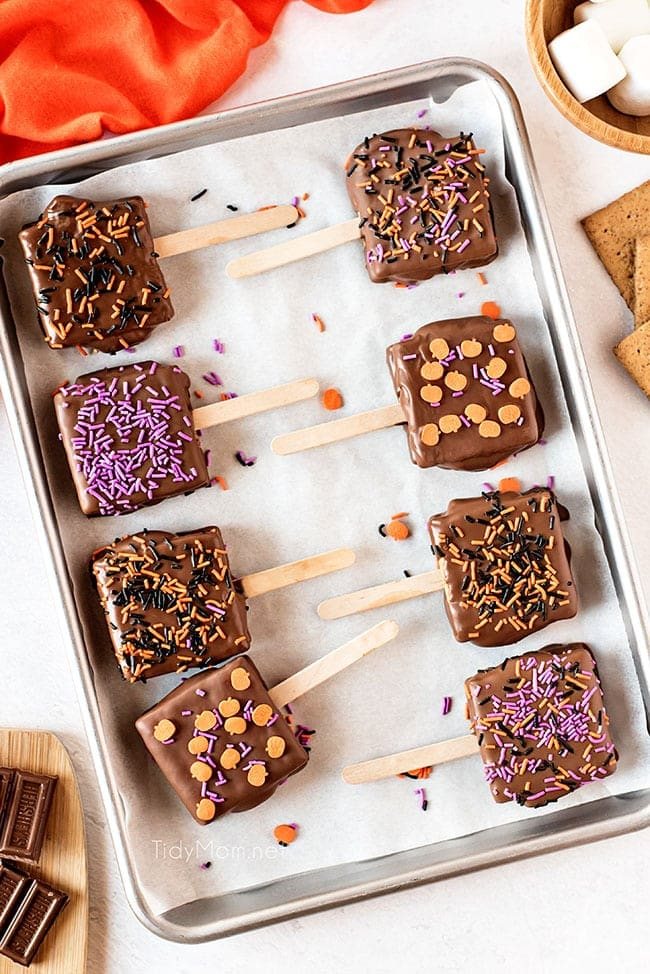 s'mores pops with halloween sprinkles on a pan