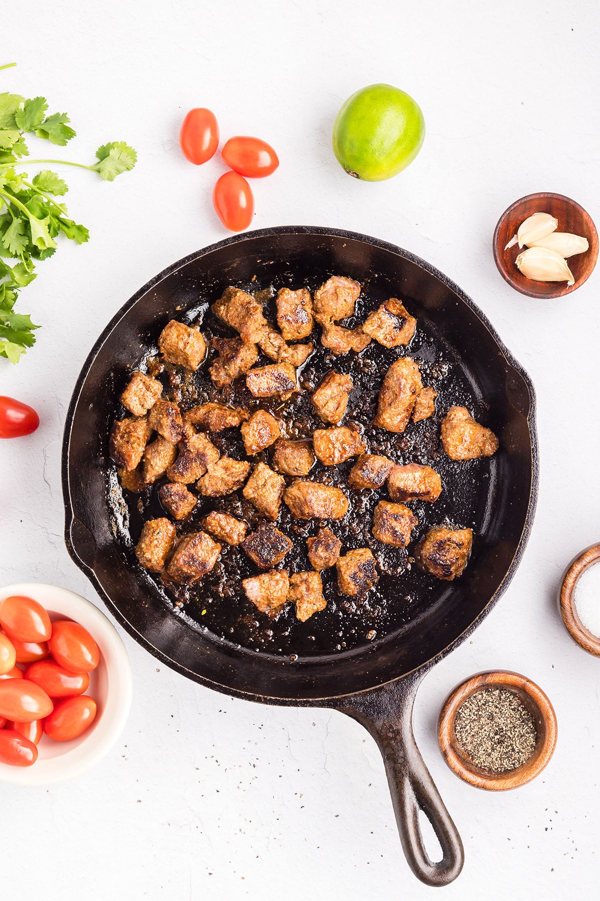 Cooking seasoned sirloin steak in a hot skillet until browned and caramelized