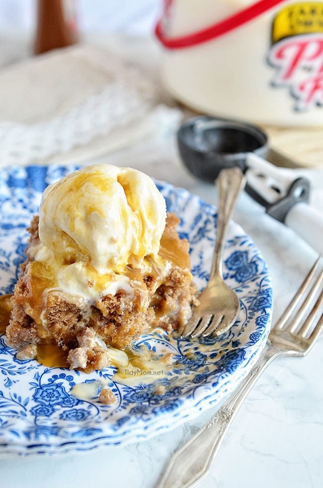 Cinnamon Roll Poke Cake is dangerously easy and tastes just like the gooey center of a cinnamon roll! This recipe starts with a spice cake mix and can of soda,comined with sweetened condensed milk, topped with vanilla ice cream and caramel sauce and you end up with the most delectable cake that ever lived! at cetcu.com