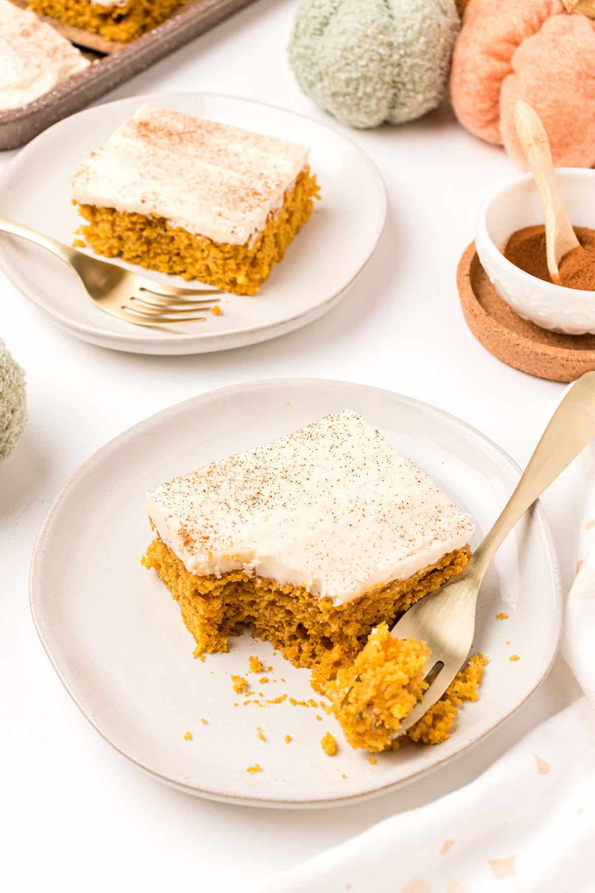 Easy pumpkin bar on a plate with a fork and a bite taken.