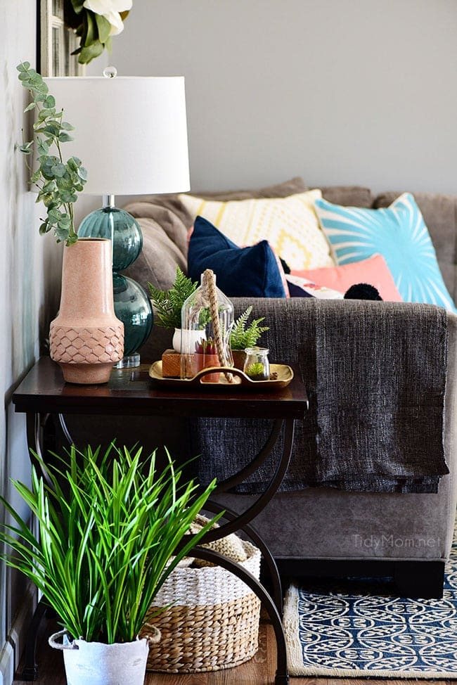 Transition to Spring Family Room Decor. Kick winter to the curb! Bring in the feel of freshness and spring to your home with lots of greenery, flowers and colorful pillows. See the full Spring Family Room Tour at cetcu.com
