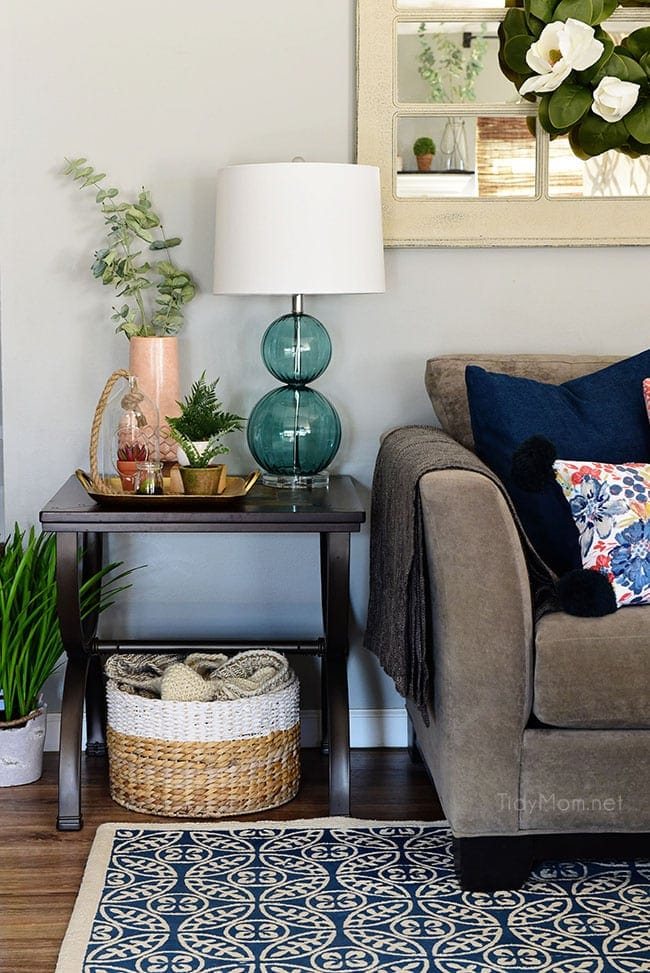 Transition to Spring Family Room Decor. Kick winter to the curb! Bring in the feel of freshness and spring to your home with lots of greenery, flowers and colorful pillows. See the full Spring Family Room Tour at cetcu.com