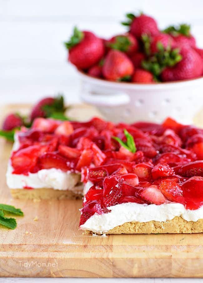 Strawberries and Cream Magic Bars made with fresh glazed strawberries and a sweet cream cheese layer with a Golden Oreo crust!