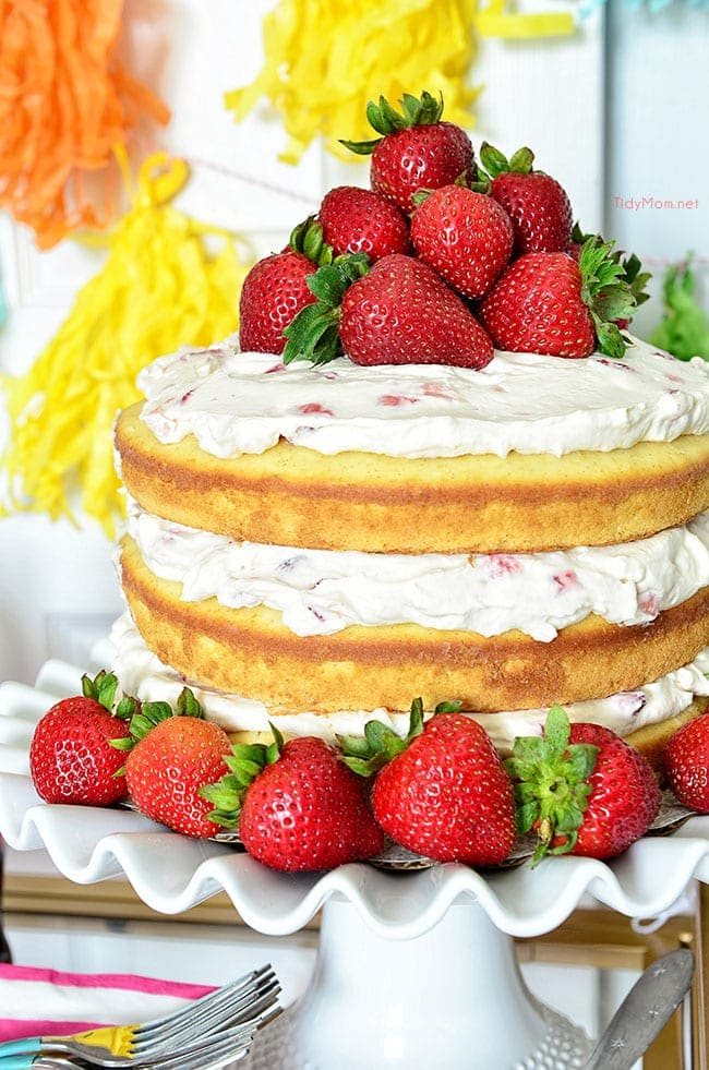 Homemade Strawberries and Cream Naked Cake recipe: 3 delicious layers of homemade pound cake, with fresh strawberries and a dreamy vanilla whipped cream cream cheese frosting at cetcu.com
