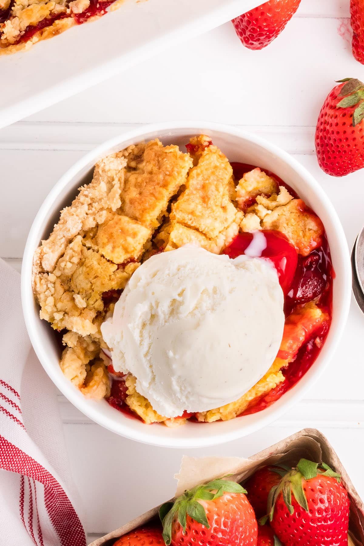 bowl of dump cake with a scoop of ice cream