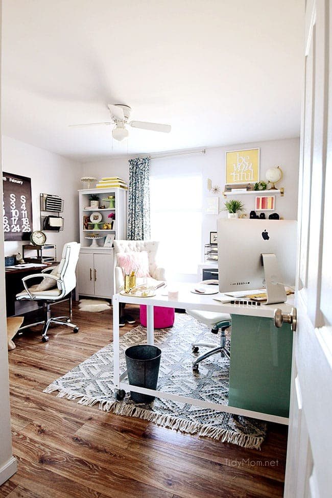 Decorating a shared office, with colorful industrial style. Her side is pink and gold, while his is black and neutrals. Check out the gold coffee cart!! Get all the details of this shared home office space at cetcu.com