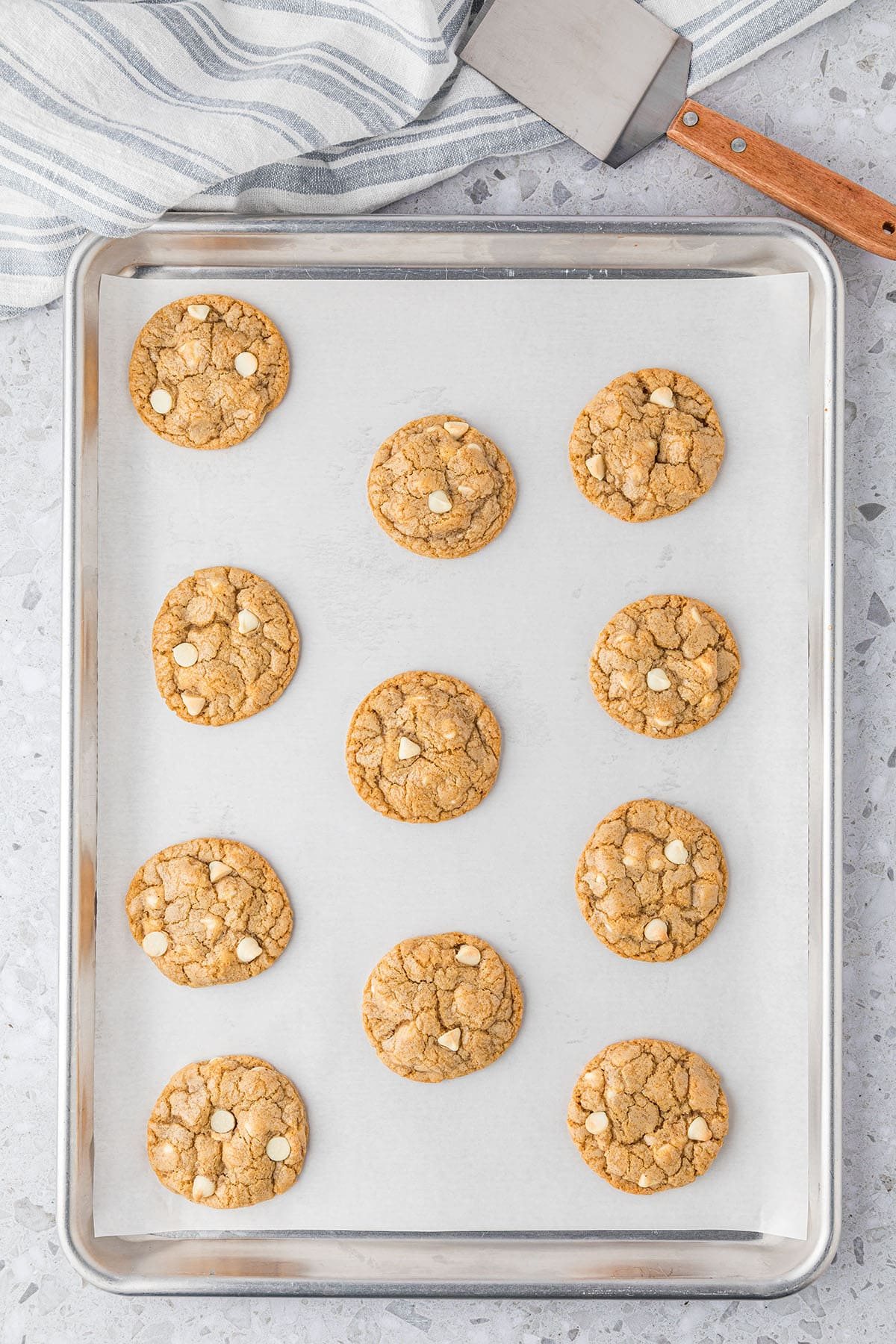 sugar doole cookies on a baking sheet with a spatula