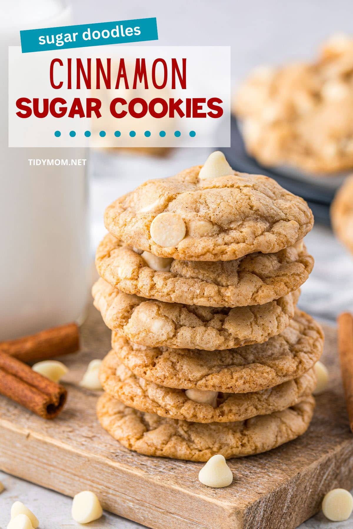 stack of cookies on a wood board with milk and white chocolate chips