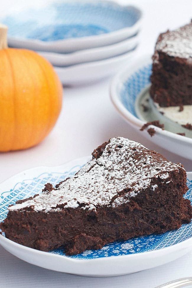 Pumpkin Spice Flourless Chocolate Cake from The Reluctant Entertainer: The Ultimate Thanksgiving Menu Plan from make-ahead slow cooker turkey and peacan topped sweet potatoes to cranberry appetizers and pumpkin creme brulee. You’ll find family favorite Thanksgiving recipes that will have them coming back for more!! Get all the Thanksgiving Menu Recipes at cetcu.com