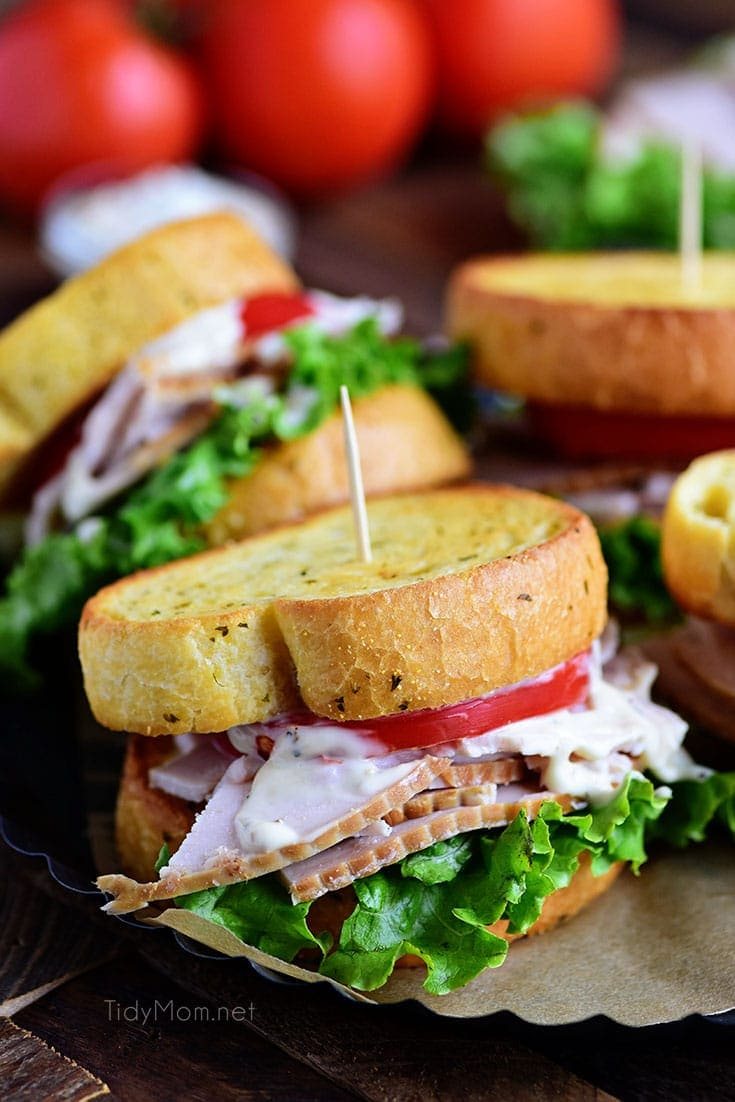 Turkey Caesar Sandwich. Easy homemade caesar dressing and garlic toast turns an ordinary cold-cut sandwich into something special. Perfect way to use up left-over Thanksgiving turkey or any day with deli sliced turkey! Print recipe at cetcu.com