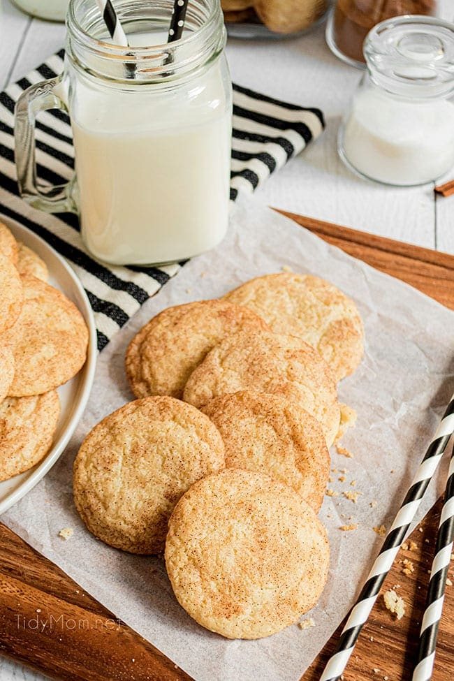 a pile of cookies with a glass of milk