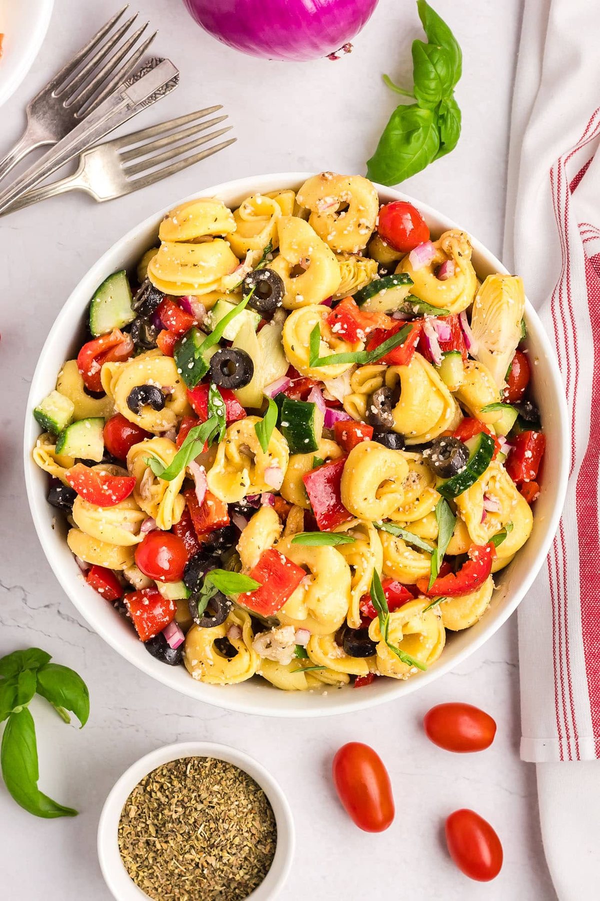 cheese tortellini pasta salad with fresh veggies in a bowl