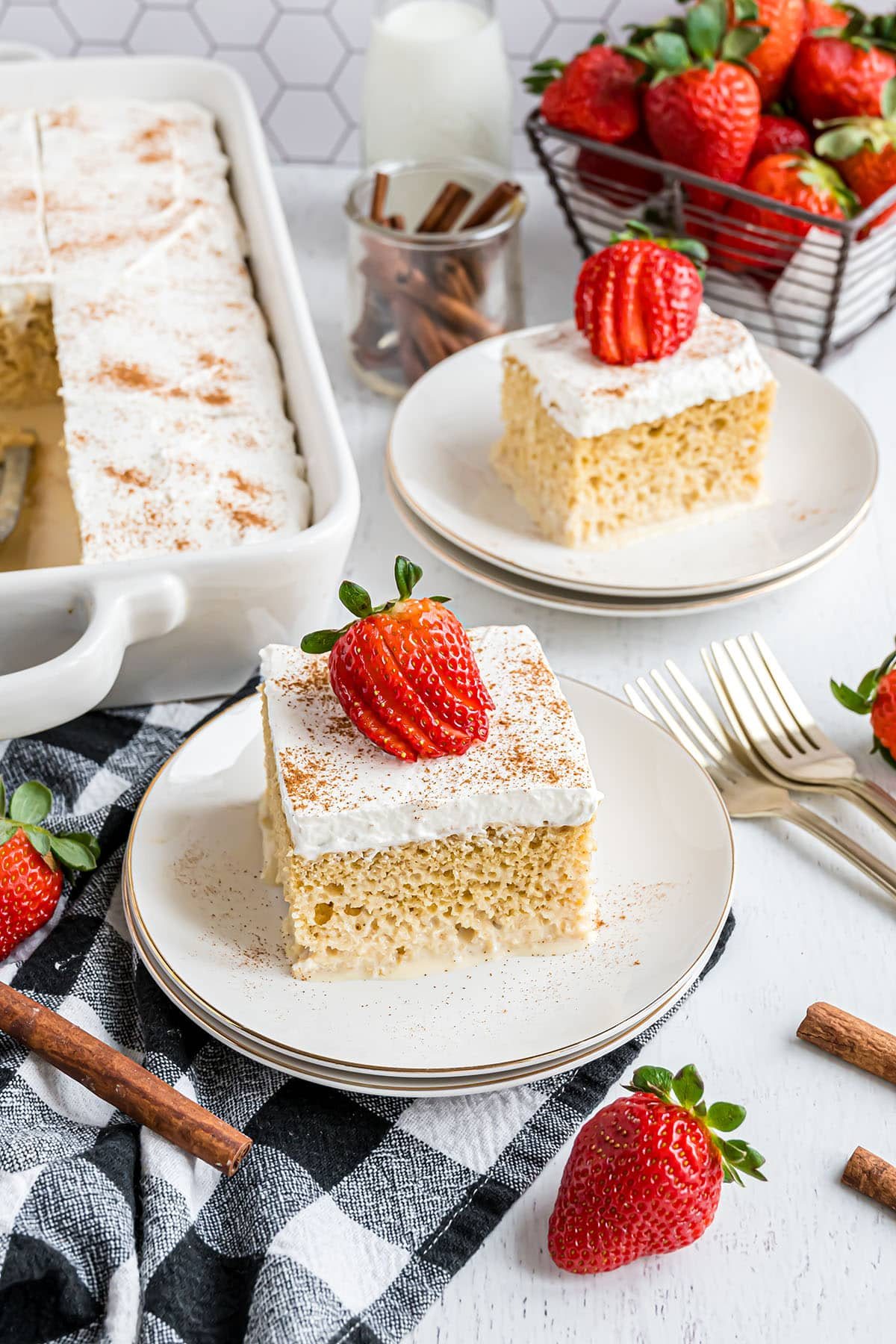 two servings of tres leches cake on plates