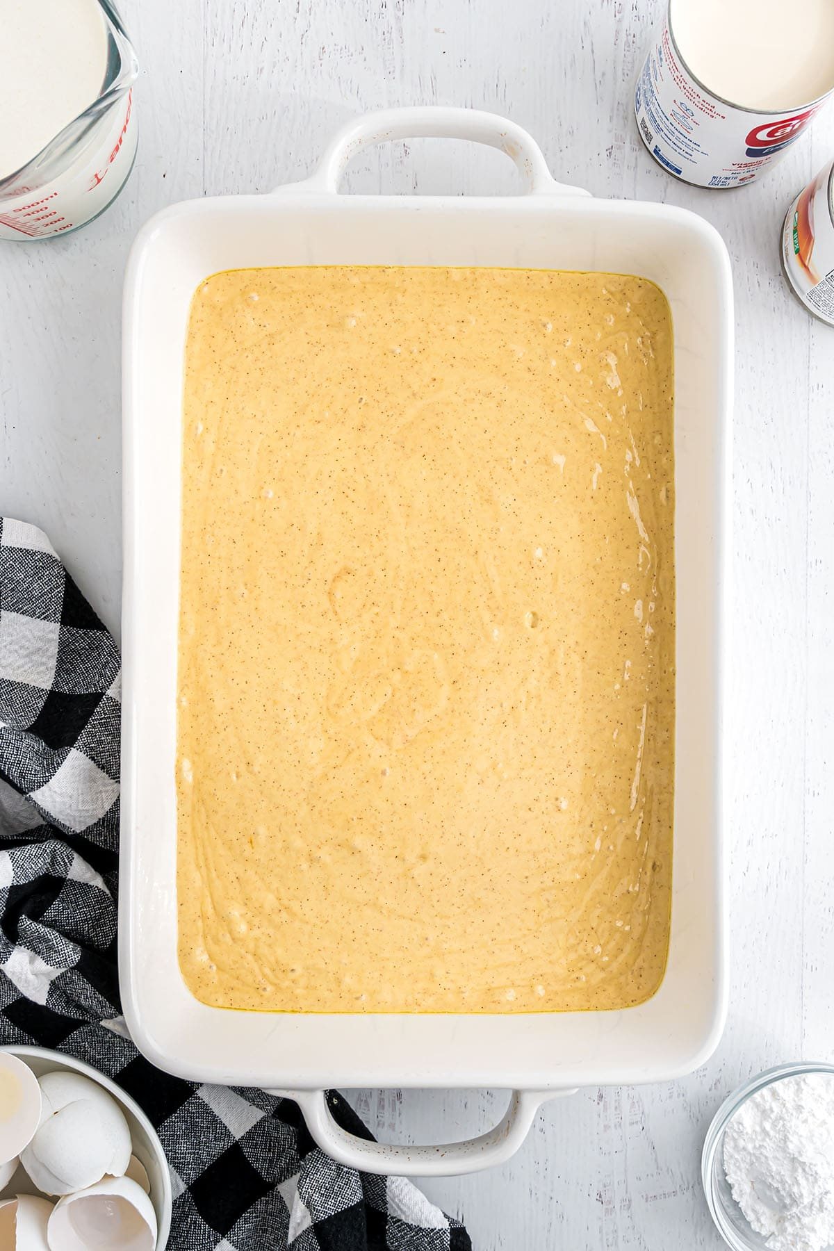 making an easy tres leches cake - Step 2, pour cake batter in pan
