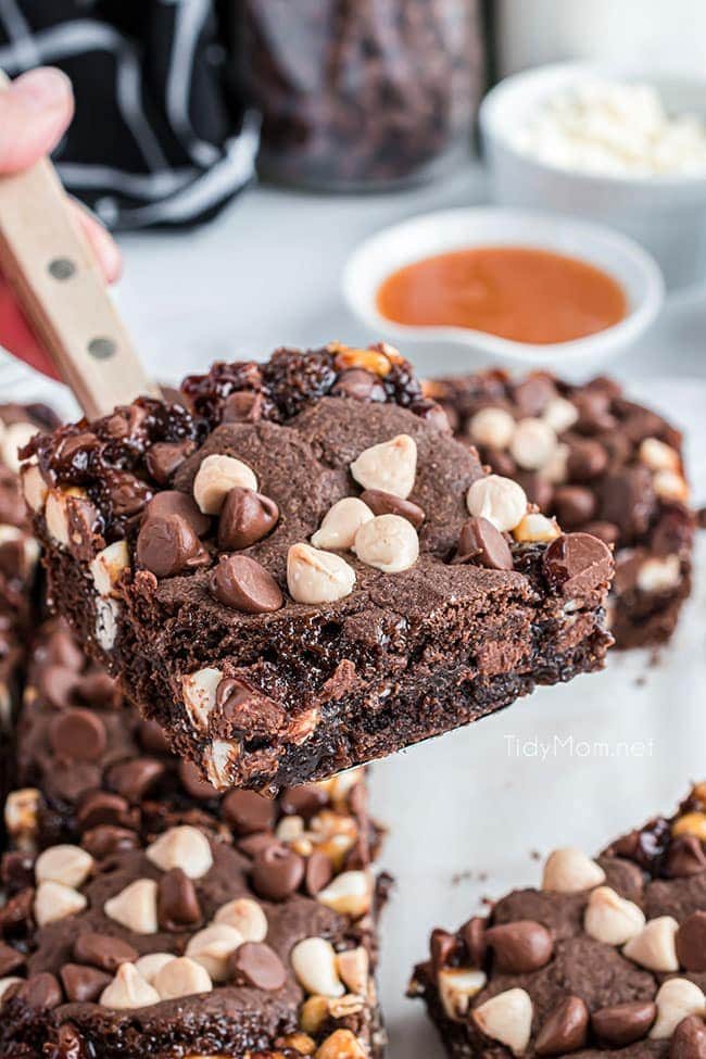 close up of chocolate caramel bar on a spatula