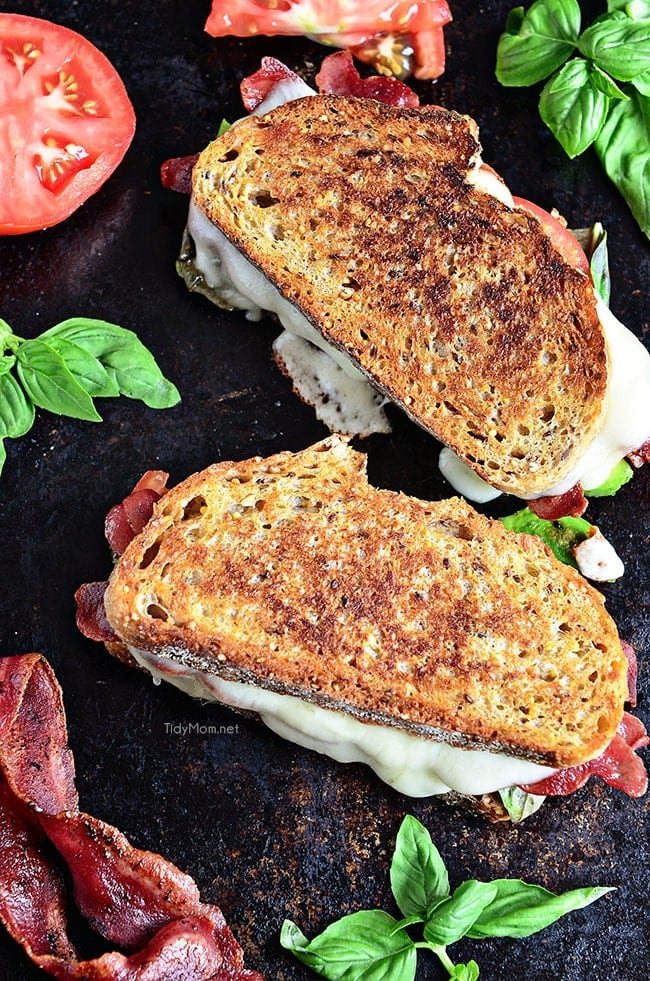 Turkey Bacon and Avocado Grilled Cheese sandwich loaded with fresh basil, tomatoes and mozzarella cheese on a hearty artisan bread. Recipe at cetcu.com