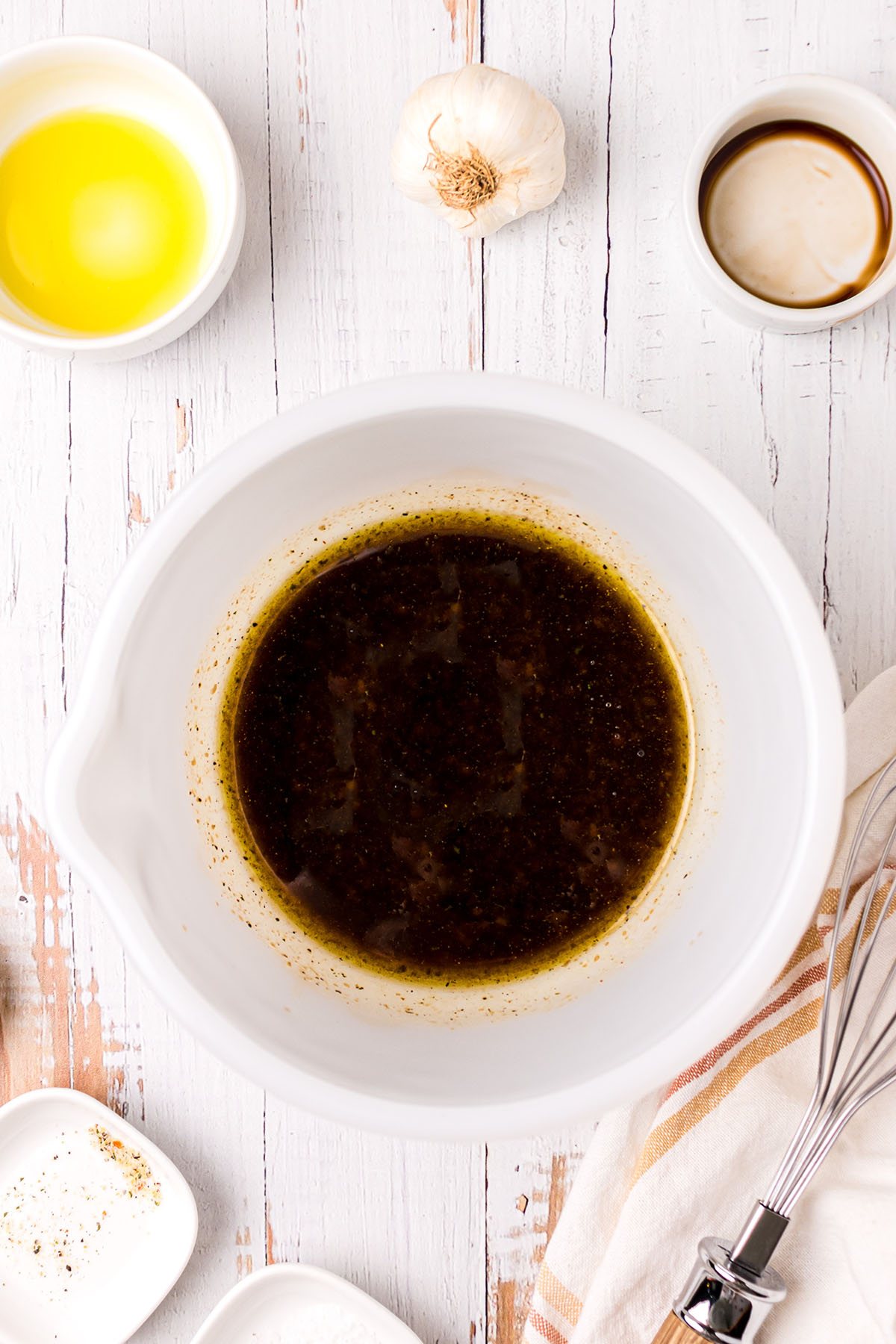 tuscan chicken marinade in a white bowl