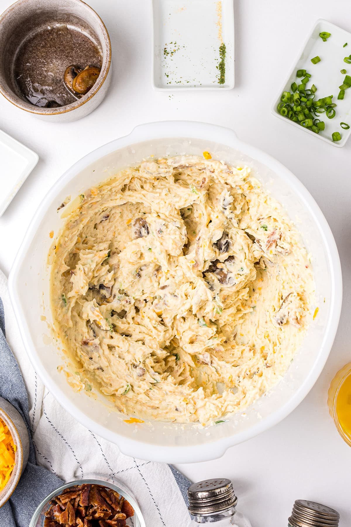 filling for twice-baked potatoes in a white mixing bowl