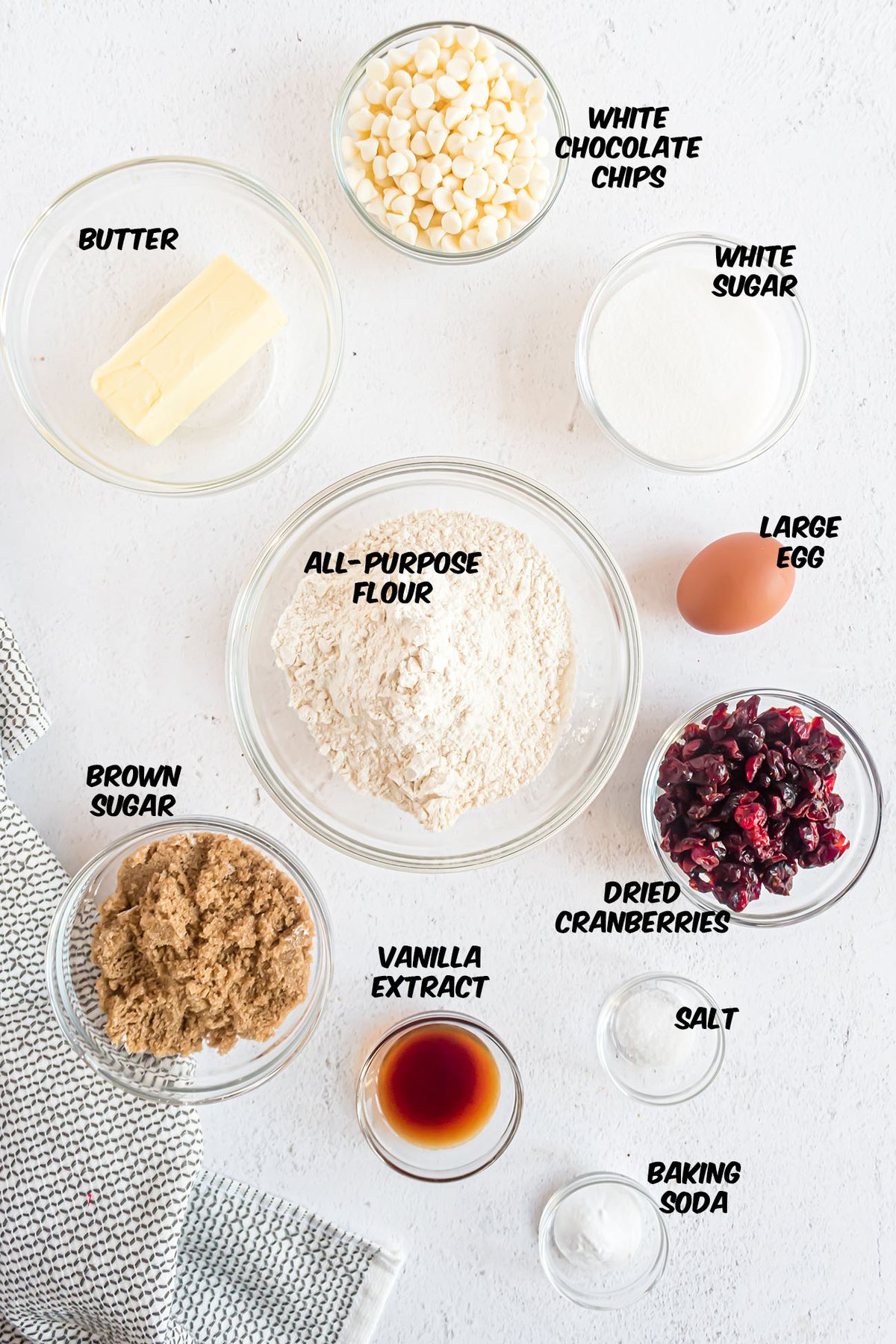 white chocolate cranberry cookie ingredients on a counter