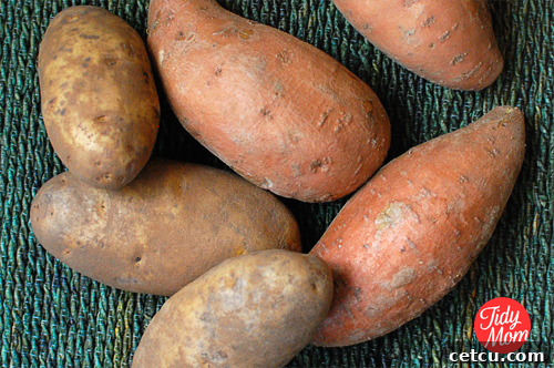Assortment of fresh potatoes, including russet and sweet varieties, symbolizing the start of a french fry reinvention project