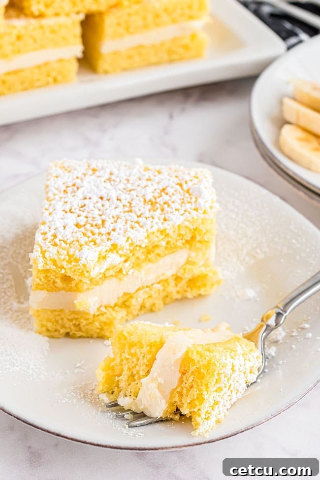 A serving of Banana Flips snack cakes on a white plate with a fork, ready to be enjoyed