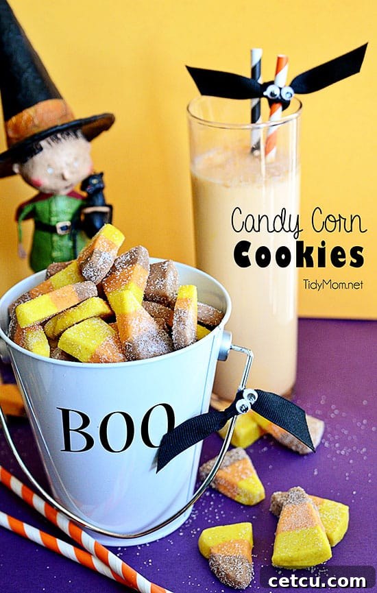 Delightful Candy Corn Cookies arranged in a bucket with a glass of orange milk