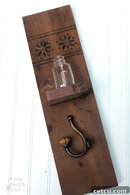 Marking the positions for the shelf and coat hook on the main wood panel