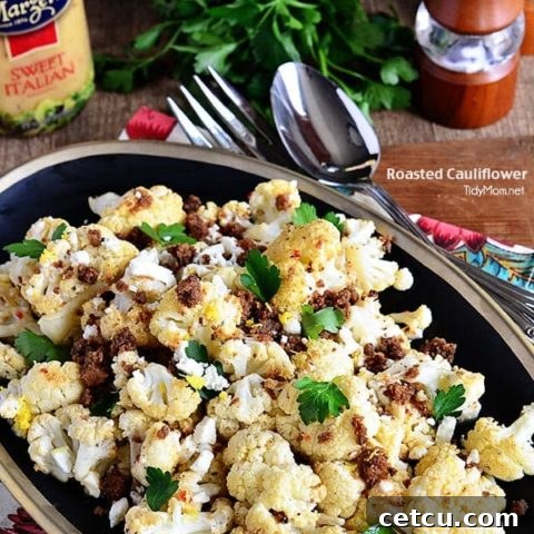 The BEST Roasted Cauliflower recipe with Italian dressing, feta cheese and browned butter crouton crumbs at TidyMom.net