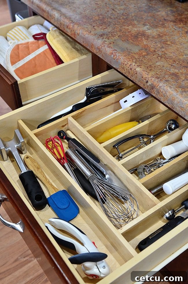 Smart Kitchen Drawer Solutions 7 After: Perfectly organized kitchen tool drawer with dividers at TidyMom.net