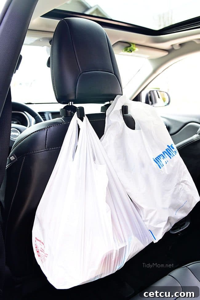 Multiple headrest hooks holding various bags