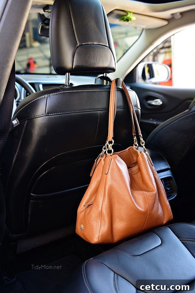 Headrest hook holding a purse in a car