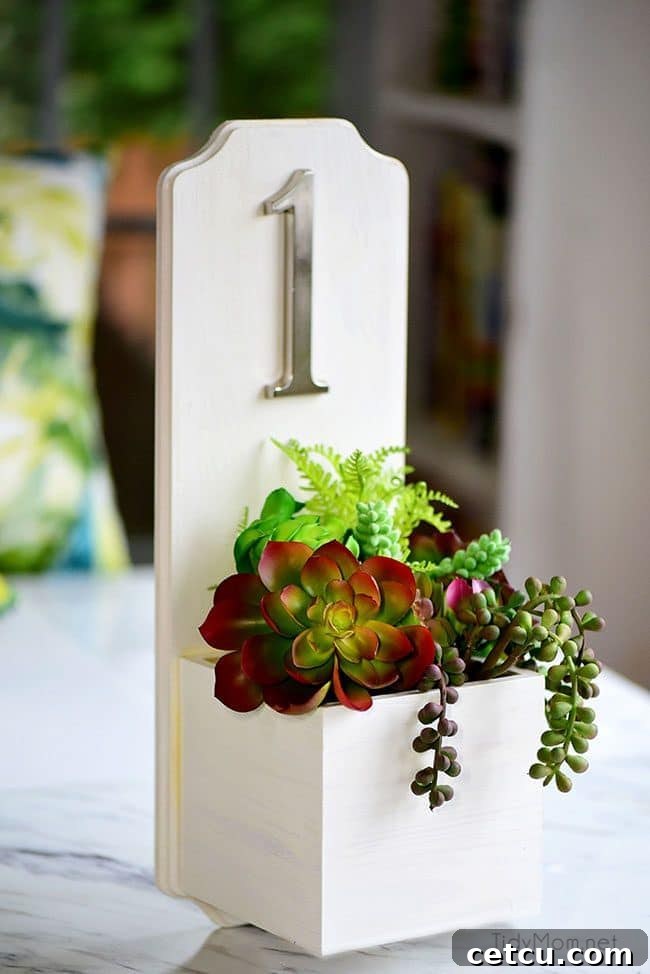 Beautifully crafted DIY Address Planter Box with faux succulents and a bold house number, showcasing enhanced curb appeal