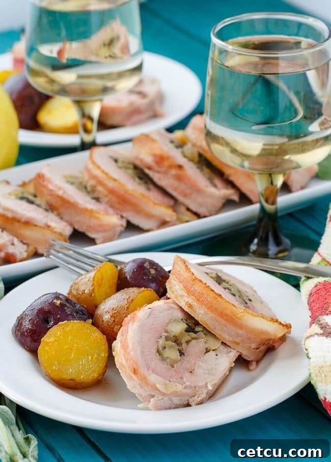 Bacon Wrapped Apple Stuffed Pork Tenderloin, a gourmet barbecue entree