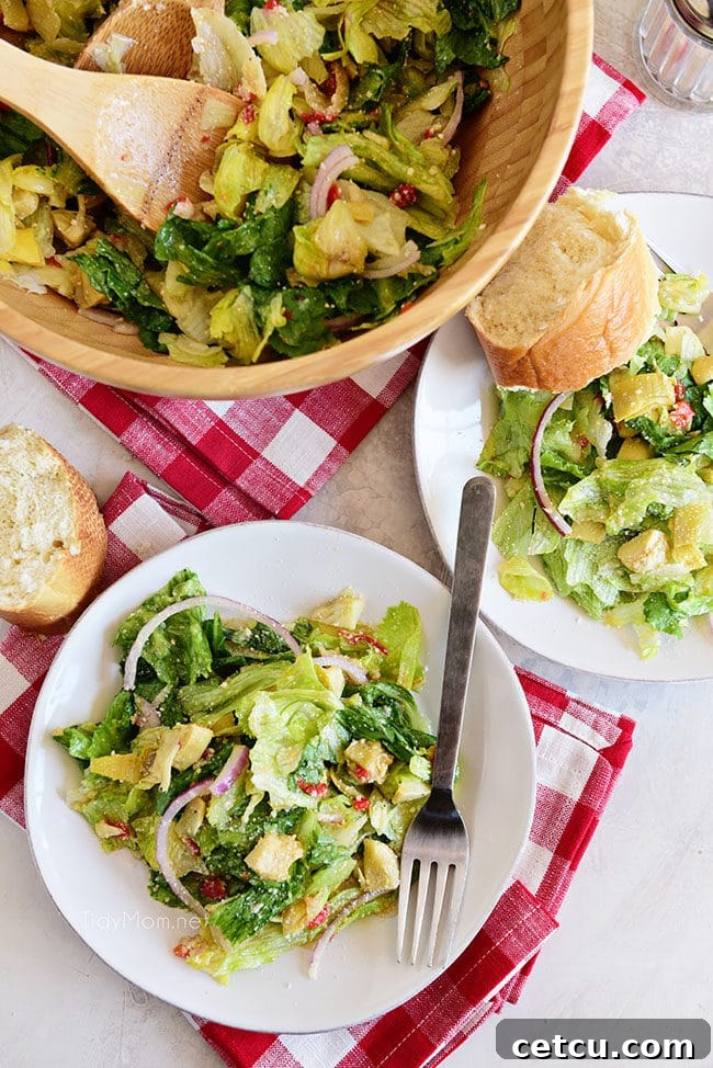close-up of restaurant-style Italian Salad with fresh ingredients and vibrant colors, including crisp lettuce, red onion, and artichoke hearts