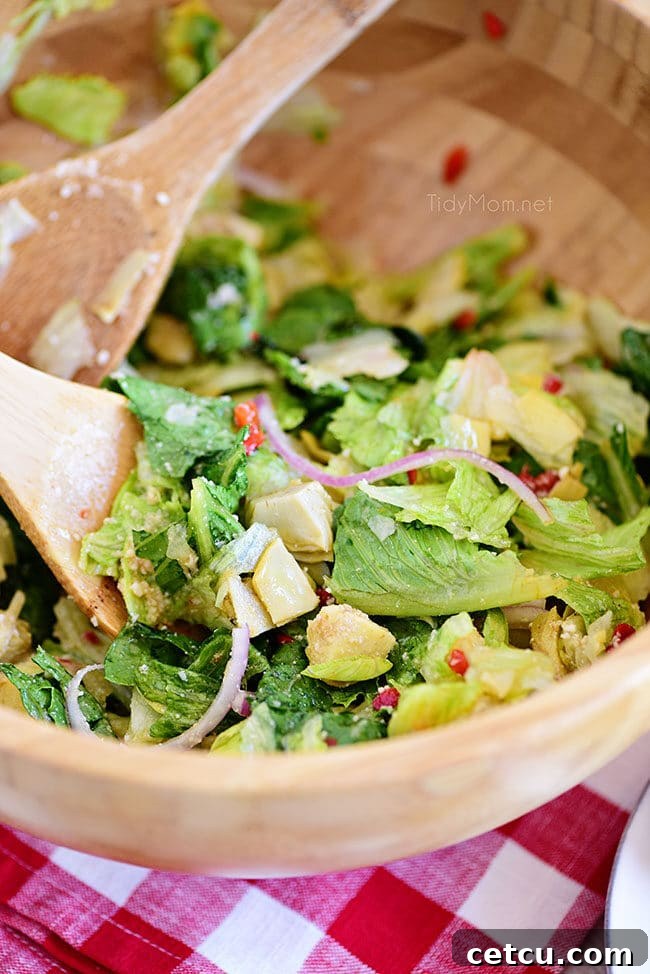 restaurant-style Italian Salad in a rustic wooden bowl, ready to be served at a family gathering, featuring a variety of fresh vegetables