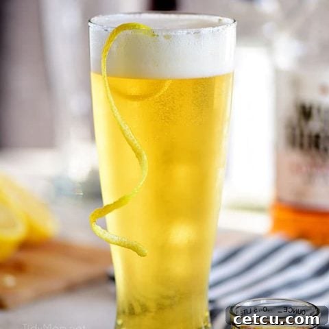 boilermaker beer cocktail with a lemon twist in a frosty glass