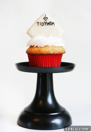 After: A small, elegant DIY cupcake stand, painted black and ready for display