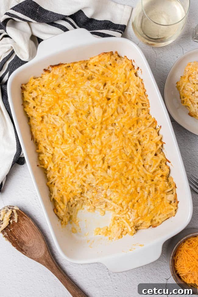 Loaded Cheesy Hashbrown Bake 6 photo of hashbrown casserole in a white baking dish on a counter