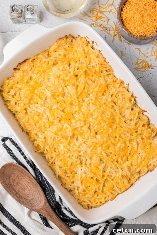Loaded Cheesy Hashbrown Bake 8 hashbrown potato casserole in a white baking dish