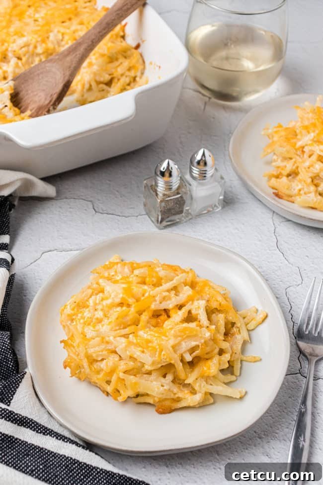 Loaded Cheesy Hashbrown Bake 9 two plates with hashbrown casserole