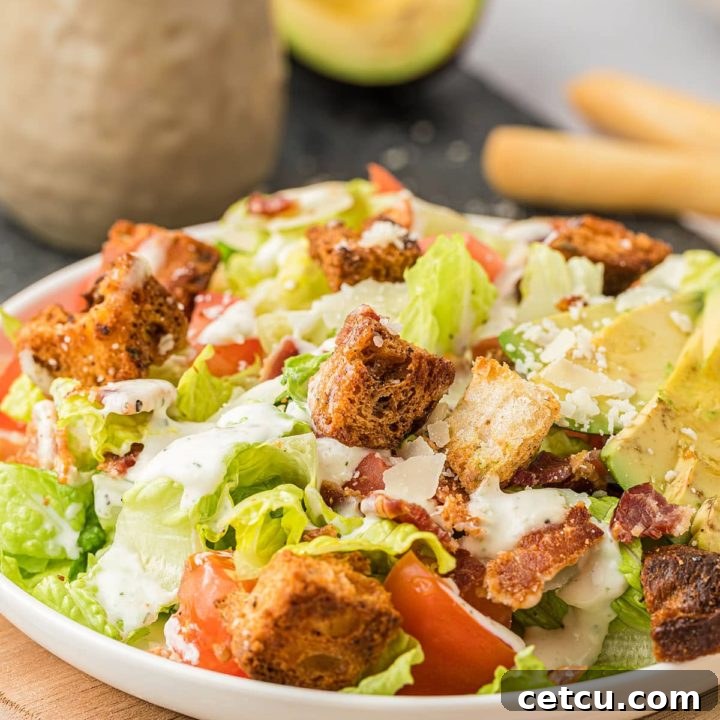 A beautifully presented BLT salad with creamy homemade dressing, ready to be served and enjoyed.