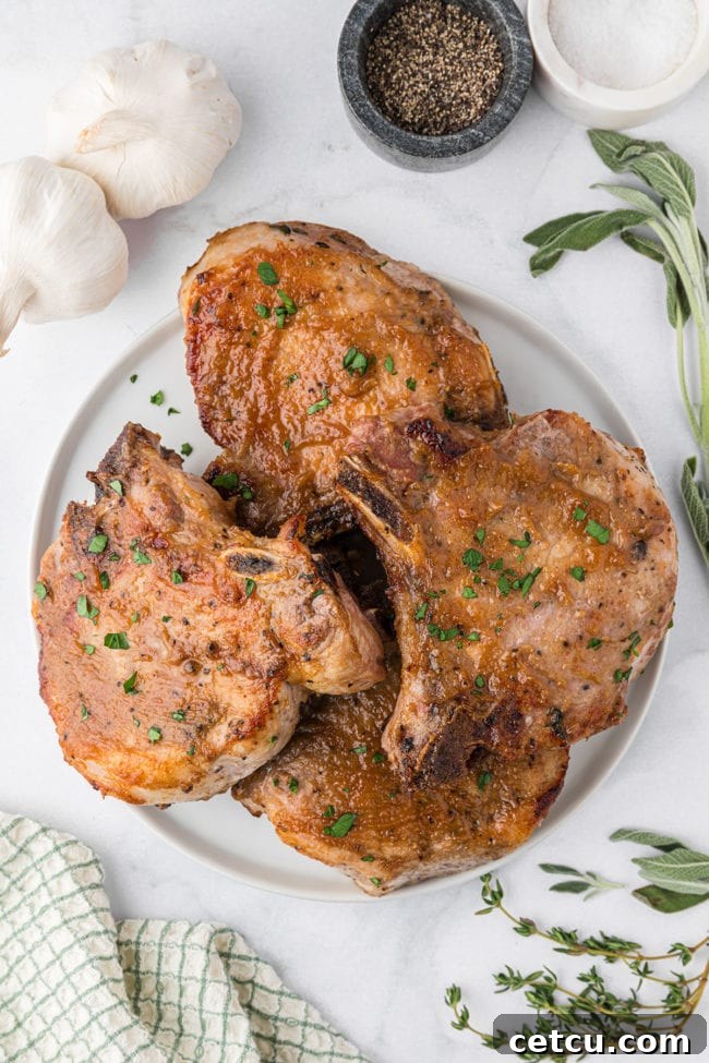 a plate of glazed pork chops on a table