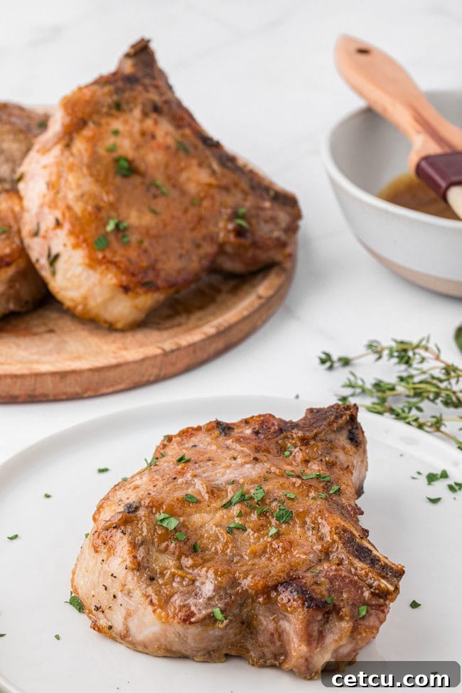 Oven baked glazed pork chops on a table