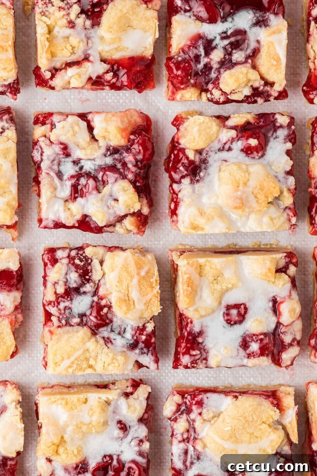 cherry pie bars cut in to square servings