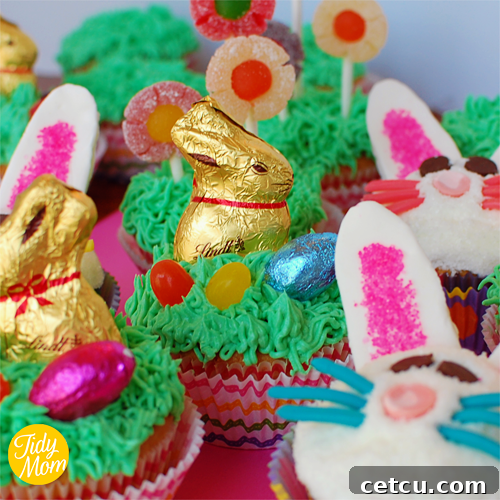 Three decorated spring easter cupcakes including bunny and flower designs